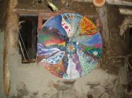 Mandala door, with hinges on cob house Older shop jobs 104.jpg