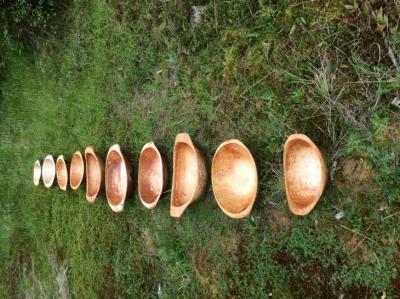 Assortment of hand carved bowls carved with adzes