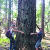 Squitty View - Gretje and James hug a big tree at Squitty Bay Day 2015